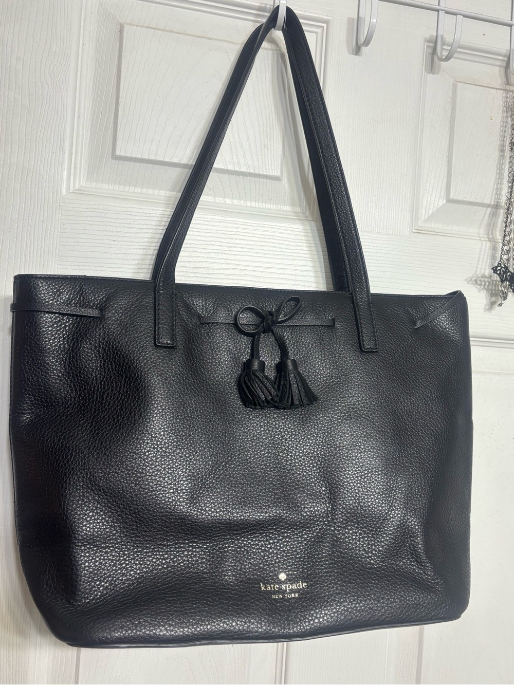 Sophisticated black pebbled leather tote from Kate Spade New York.